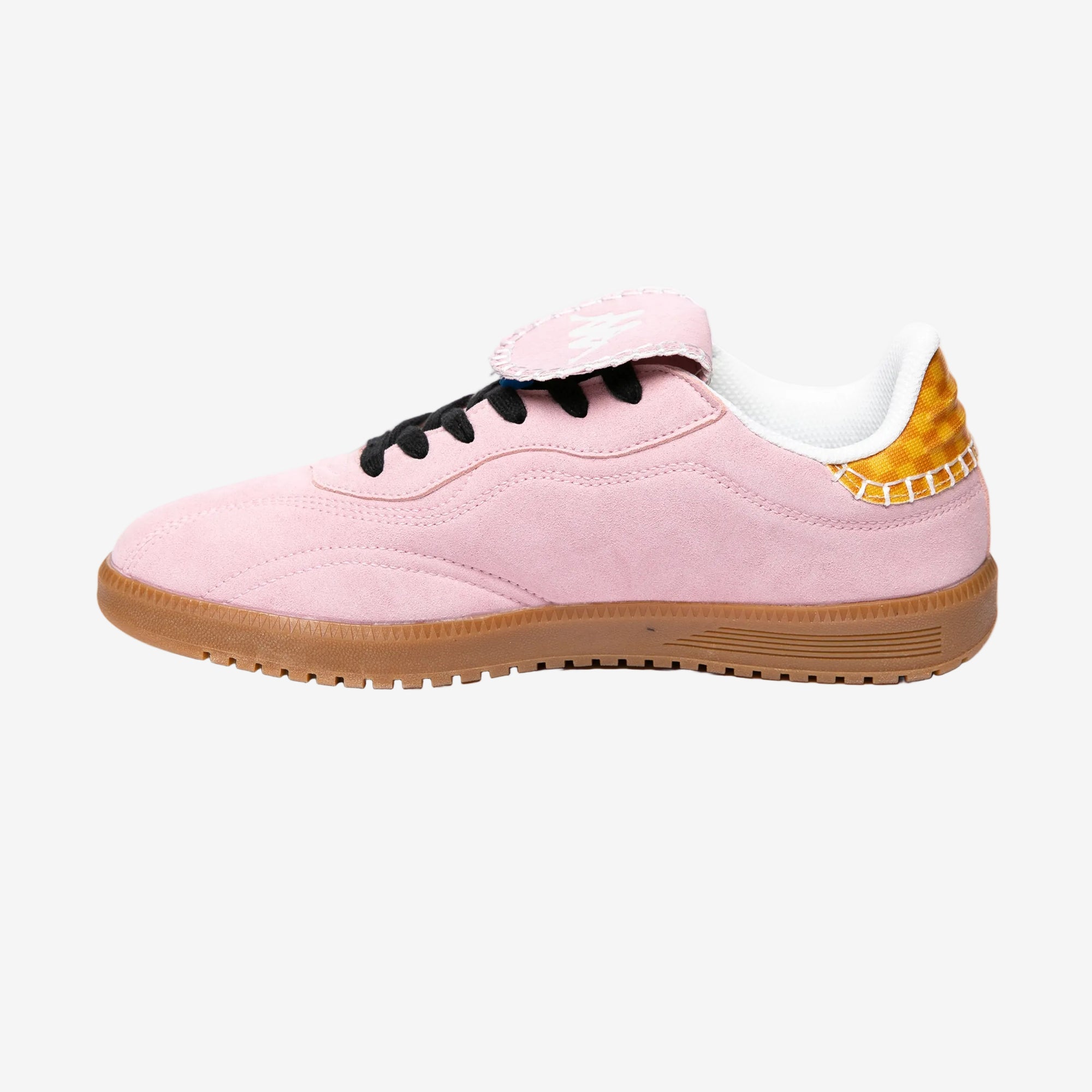 Pink sneaker with a white sole on a white background