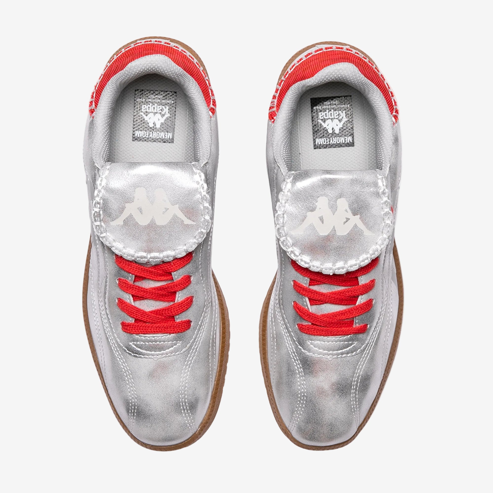 White sneakers with red laces and soles on a white background
