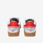 Pair of red and silver sneakers with brown soles on a white background
