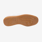 Close-up of a shoe sole with a textured pattern on a white background