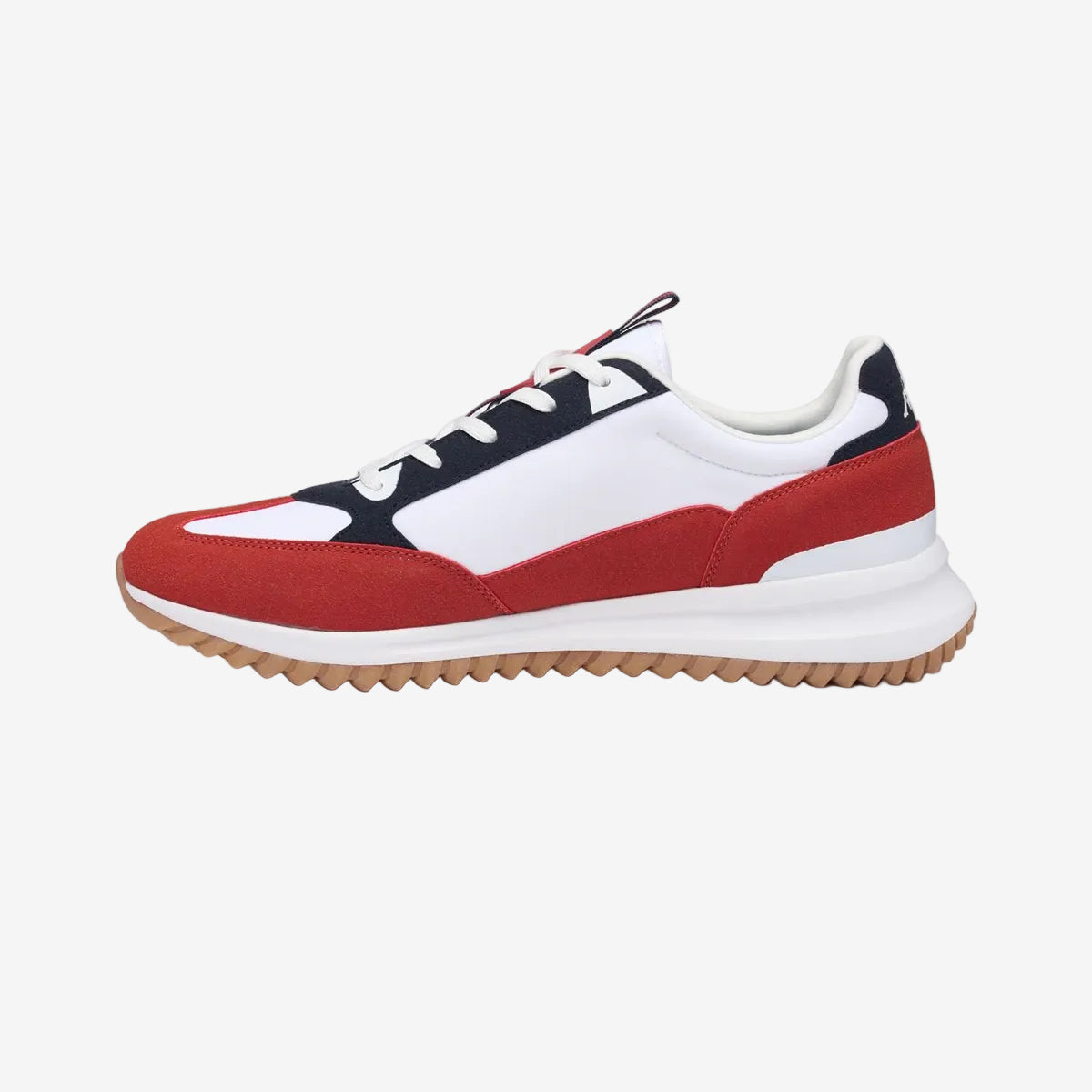 Sneaker with red, white, and black design on a white background