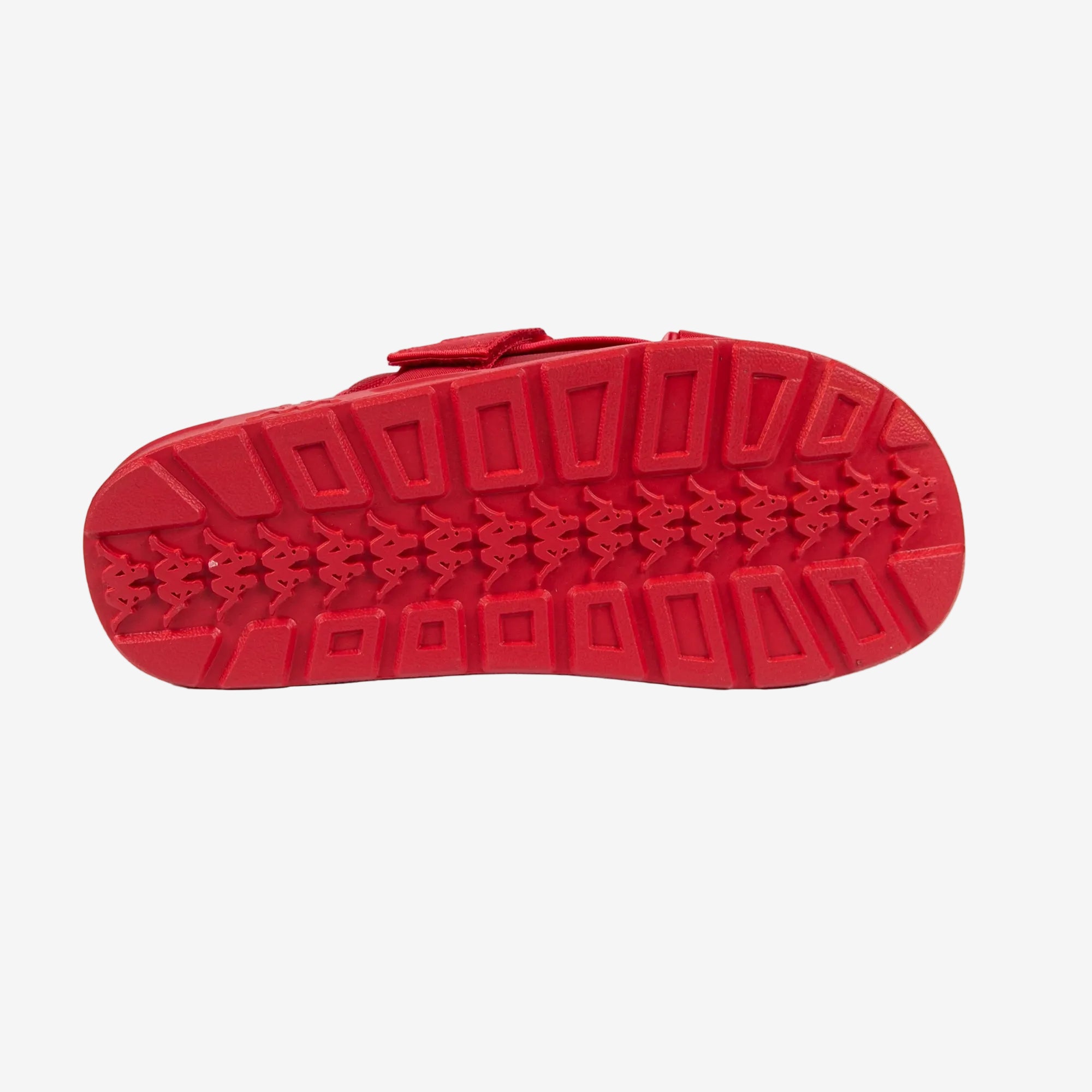 Red sandal sole with textured pattern on a white background