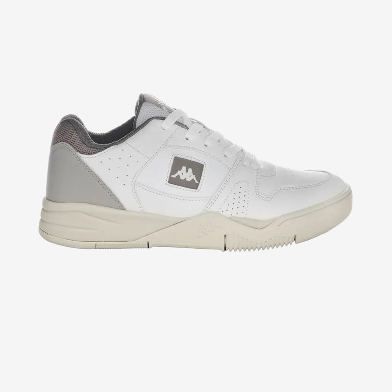 A pair of low-top sneakers with white upper material and grey accents, featuring a hook and loop fastener closure and a rubber outsole.