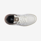 White sneaker with brown sole on a white background