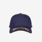Navy blue cap with Modelo logo in gold across front bill.