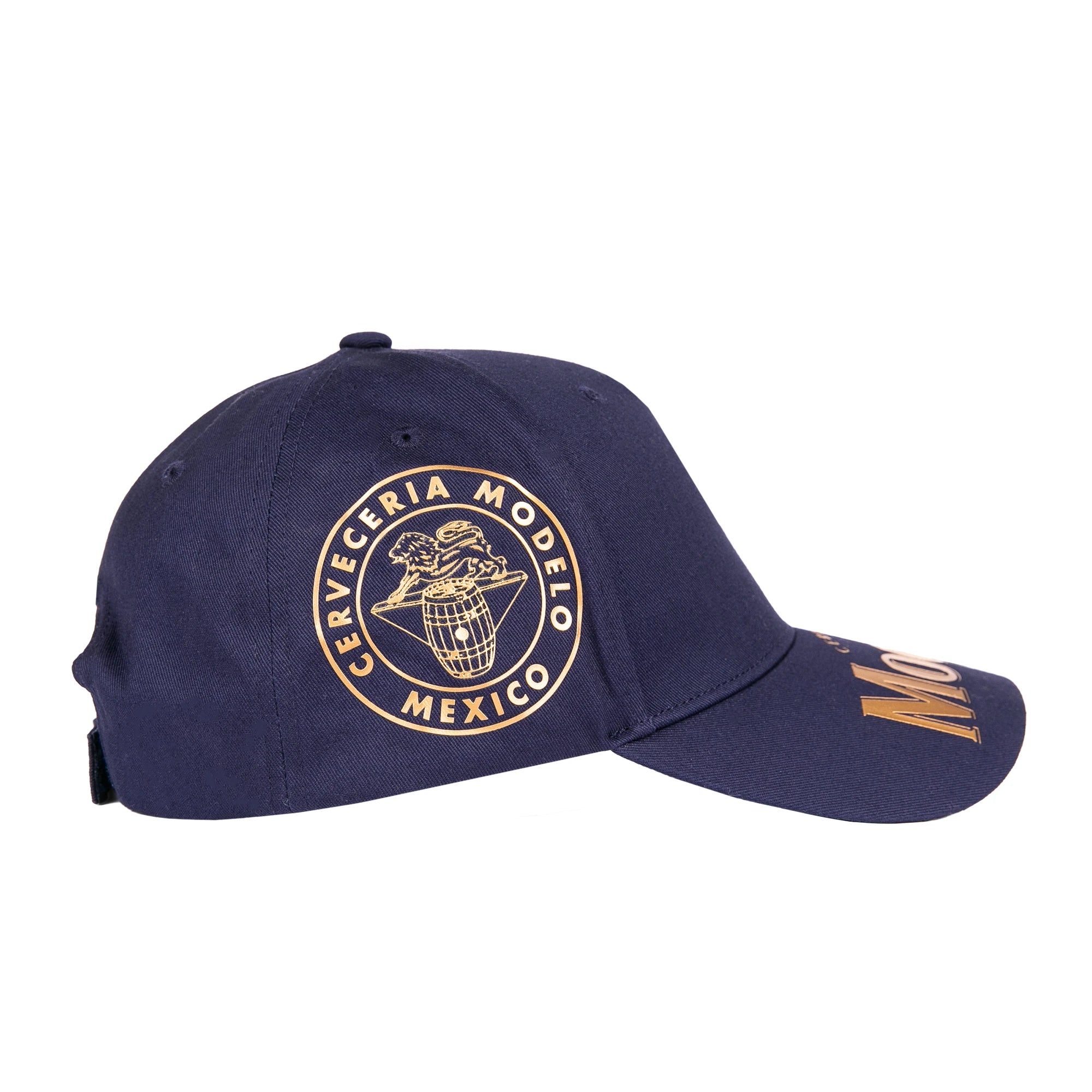 Modelo logo in gold on navy blue cap displaying the right side.