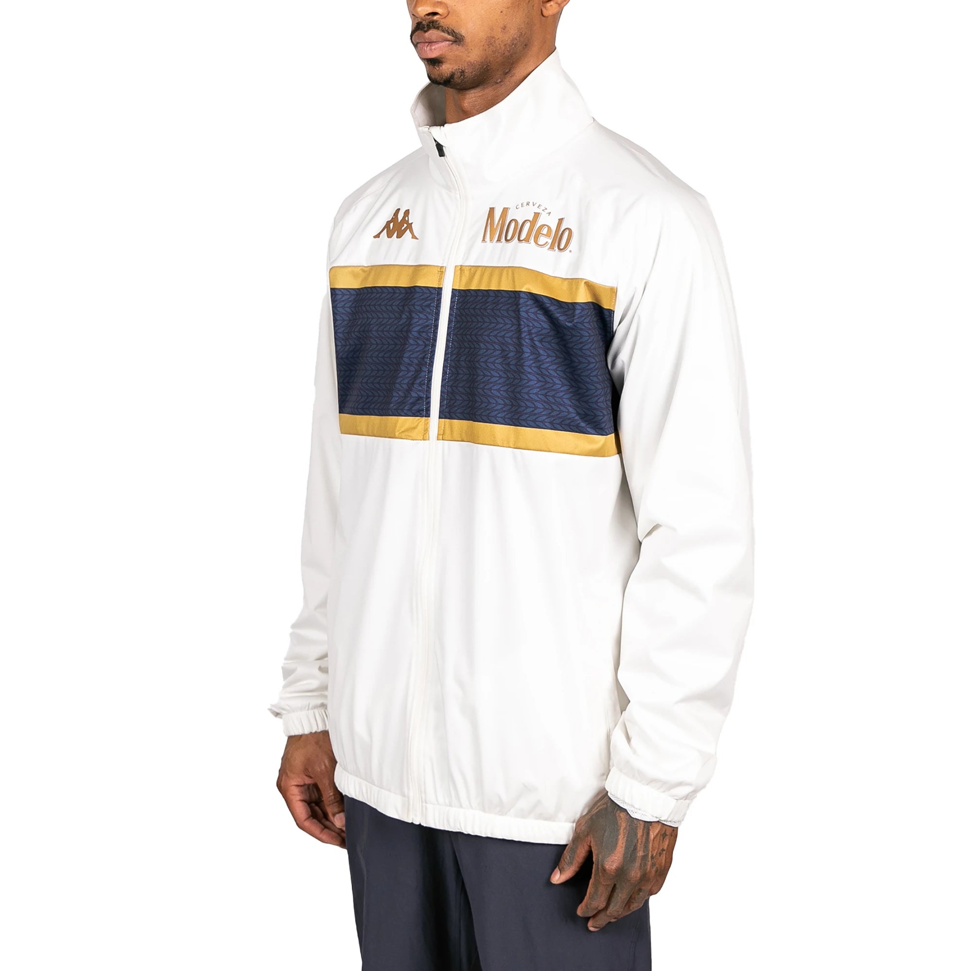 Male model wearing Arapi Modelo Jacket in white. Side view.