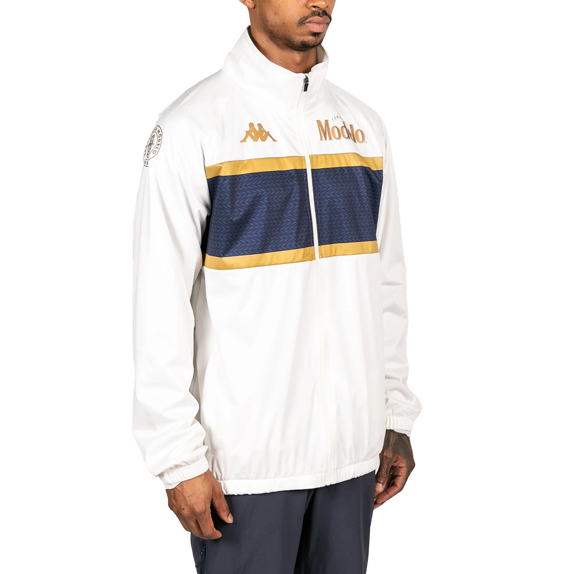 Male model wearing Arapi Modelo Jacket in white. Side view.
