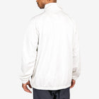 Male model wearing Arapi Modelo Jacket in white. Back view.