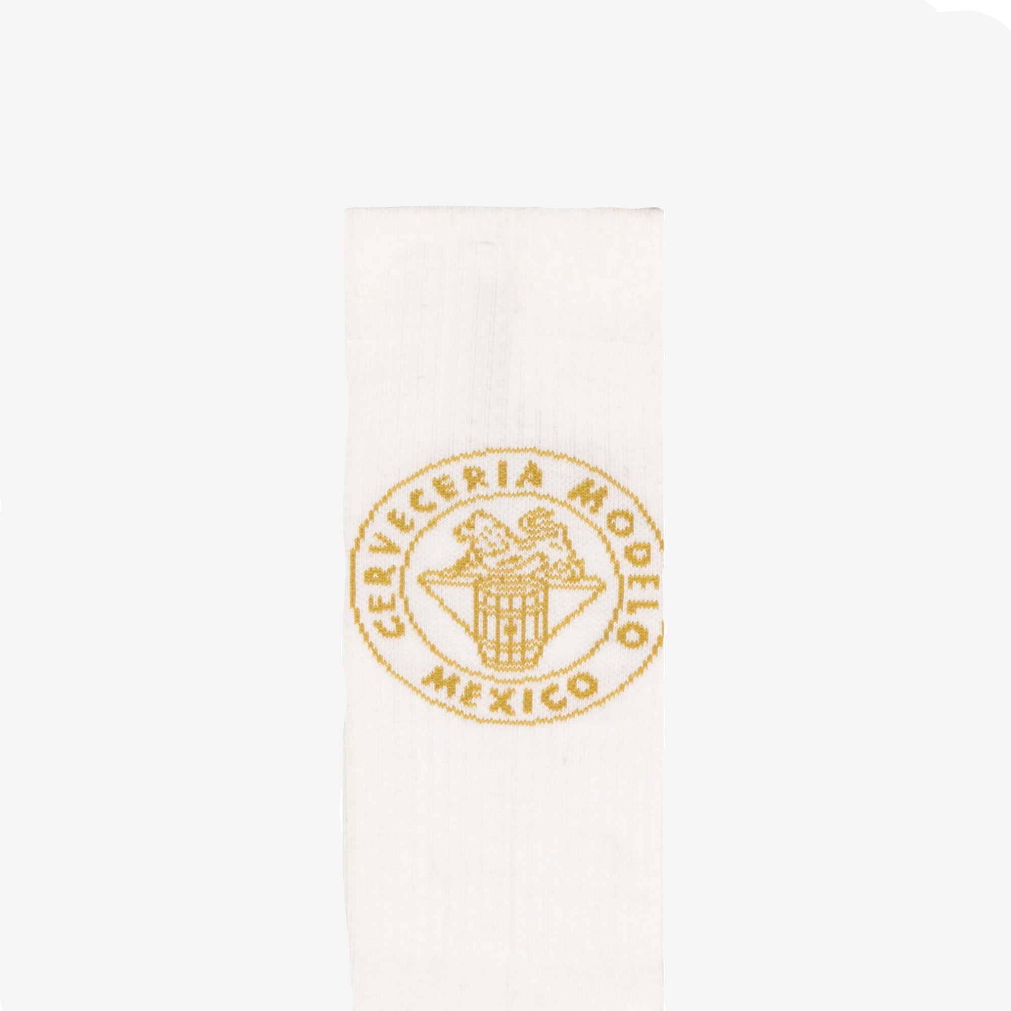 Detail view of Modelo logo on white sock.