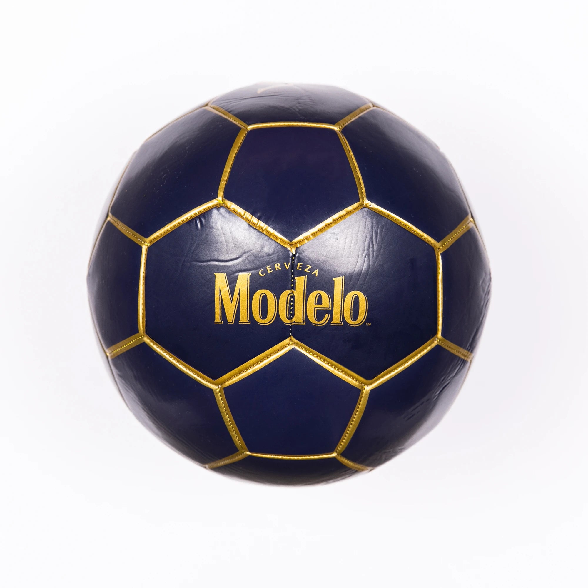 Blasty Modelo Soccer Ball in dark blue with gold details showing the large Modelo logos.