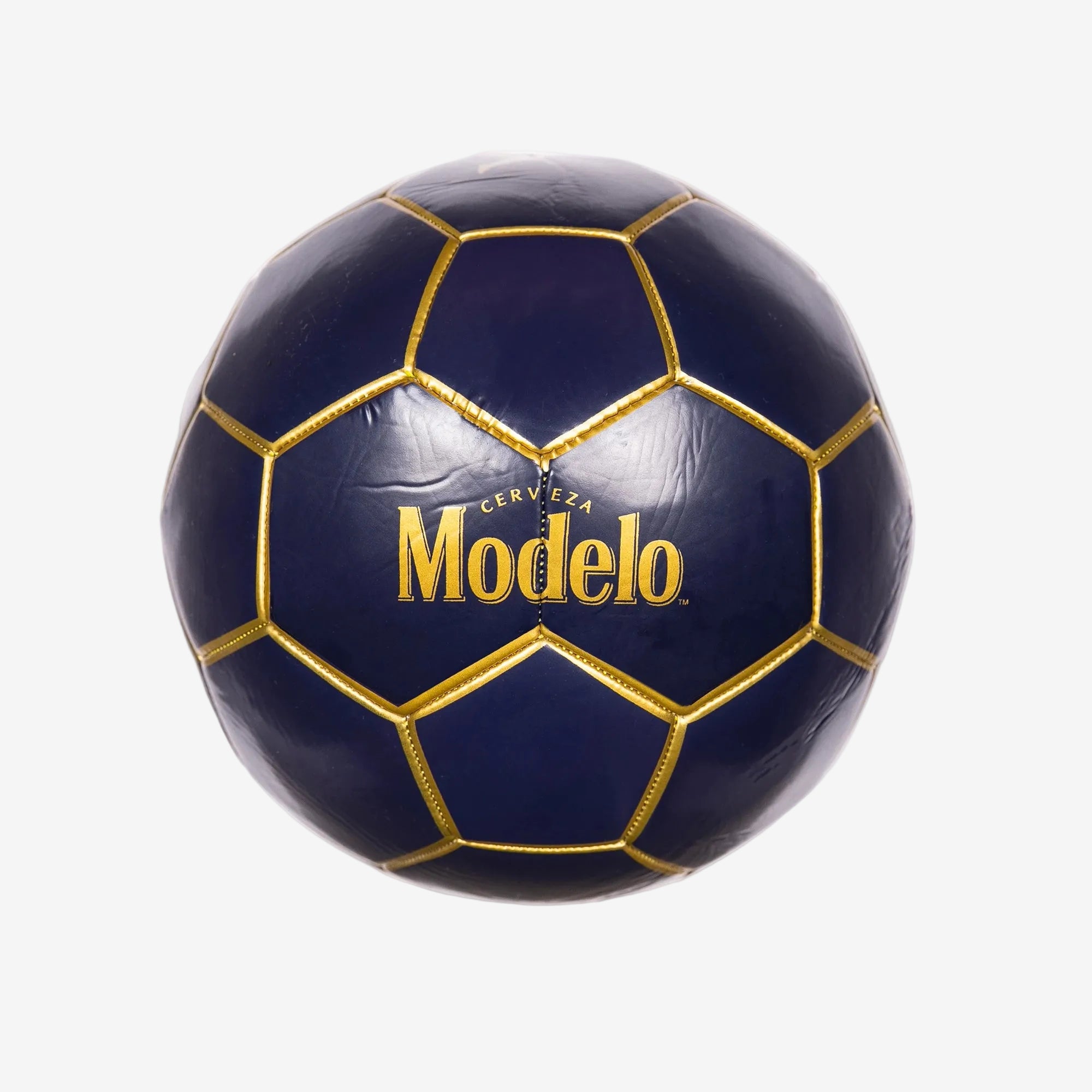 Blasty Modelo Soccer Ball in dark blue with gold details showing the large Modelo logos.
