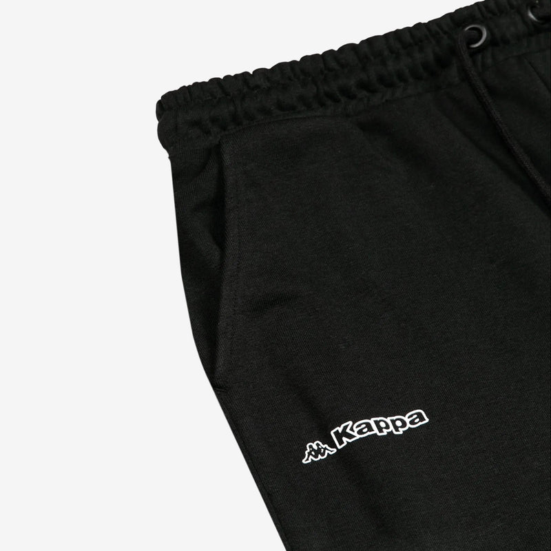 Detail view of Kappa lettering and Omini logo in white on black shorts.