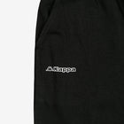 Detail view of Kappa lettering and Omini logo in white on black shorts.